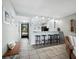 Kitchen featuring counter seating, tile floors, and ample natural light at 605 Sutton Pl # 205, Longboat Key, FL 34228