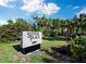 Beautifully landscaped sign in front of the property at Sutton Place at 605 Sutton Pl # 205, Longboat Key, FL 34228