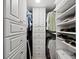 Well-organized walk-in closet featuring shelving and drawers for maximum storage at 605 Sutton Pl # 205, Longboat Key, FL 34228