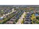 An aerial view showcasing the neighborhood's lush landscaping, well-maintained streets, and community pond at 11422 Griffith Park Ter, Bradenton, FL 34211