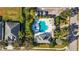 Inviting community pool featuring a hot tub, a sundeck and ample seating areas, surrounded by lush landscaping at 11422 Griffith Park Ter, Bradenton, FL 34211