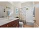 Bathroom features a single vanity, large mirror, toilet, and a shower/bath at 11422 Griffith Park Ter, Bradenton, FL 34211