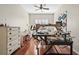 Room features a sewing machine, dresser, desk, hardwood floors, and shutters at 11422 Griffith Park Ter, Bradenton, FL 34211