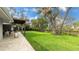 Expansive backyard with patio and a fence at 3348 S Seclusion Dr, Sarasota, FL 34239