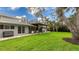 Large backyard features a covered patio at 3348 S Seclusion Dr, Sarasota, FL 34239