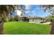 Spacious backyard with patio and lush green grass at 3348 S Seclusion Dr, Sarasota, FL 34239