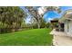 Expansive backyard featuring a lush lawn and mature trees, perfect for outdoor enjoyment at 3348 S Seclusion Dr, Sarasota, FL 34239