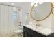 Updated bathroom with a modern sink, mirror and tub at 3348 S Seclusion Dr, Sarasota, FL 34239