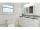 Bathroom featuring granite counters and a tiled shower at 3348 S Seclusion Dr, Sarasota, FL 34239