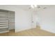 Bright bedroom featuring a fan, wood floors, and a closet with storage at 3348 S Seclusion Dr, Sarasota, FL 34239