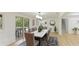 Beautiful dining room with a modern table, stylish chairs, and sliding doors to outdoor patio at 3348 S Seclusion Dr, Sarasota, FL 34239