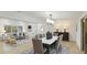 Open floor plan featuring a large dining table and modern furnishings at 3348 S Seclusion Dr, Sarasota, FL 34239