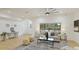 Stylish living room featuring recessed lights, contemporary furniture, and backyard views at 3348 S Seclusion Dr, Sarasota, FL 34239