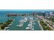 Aerial view of boats docked in a marina with city skyline and water view at 378 Golden Gate Pt # 6, Sarasota, FL 34236