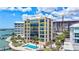 Luxury waterfront condo featuring a private pool, waterfront views, and outdoor lounge area, perfect for relaxation and entertaining at 378 Golden Gate Pt # 6, Sarasota, FL 34236
