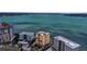 Stunning aerial view of waterfront buildings and breathtaking bay views at 378 Golden Gate Pt # 6, Sarasota, FL 34236