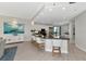 Bright and airy kitchen with stainless steel appliances, granite counters, and a large center island at 378 Golden Gate Pt # 6, Sarasota, FL 34236