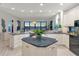 Well-appointed kitchen featuring custom cabinetry, center island, and scenic water views at 378 Golden Gate Pt # 6, Sarasota, FL 34236