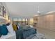 Bright main bedroom features large windows with scenic views, complemented by custom built-ins and an office area at 378 Golden Gate Pt # 6, Sarasota, FL 34236
