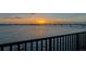 Waterfront view of a beautiful sunset over a bridge and city skyline as seen from a balcony at 378 Golden Gate Pt # 6, Sarasota, FL 34236