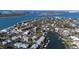 A high angle view of a waterfront community with luxurious homes and canal access to the ocean at 3939 Higel Ave, Sarasota, FL 34242