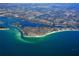 A scenic aerial view of a coastal community featuring beaches, turquoise water, and ocean access at 3939 Higel Ave, Sarasota, FL 34242