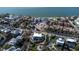 Bright aerial shot of a coastal home with lush landscaping, an outdoor lounge, and near the beach at 3939 Higel Ave, Sarasota, FL 34242
