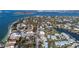 Beautiful aerial view of a waterfront community with luxurious homes and lush tropical landscaping near beach at 3939 Higel Ave, Sarasota, FL 34242