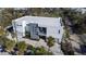 Aerial view of a modern home with lush landscaping in a desirable neighborhood at 3939 Higel Ave, Sarasota, FL 34242