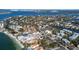 Stunning aerial view of a waterfront community with lush landscaping and beautiful homes with ocean access canals at 3939 Higel Ave, Sarasota, FL 34242
