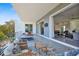 Inviting balcony with a small pool, comfortable seating, and sliding glass doors to the interior at 3939 Higel Ave, Sarasota, FL 34242