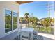 Cozy balcony with outdoor seating offering a view of the surrounding neighborhood at 3939 Higel Ave, Sarasota, FL 34242