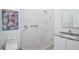 Modern bathroom with a marble shower and artistic decor at 3939 Higel Ave, Sarasota, FL 34242