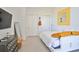 Cozy bedroom with storage and a decorative yellow mirror at 3939 Higel Ave, Sarasota, FL 34242
