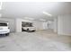 Spacious, multi-car garage with ample storage and modern lighting at 3939 Higel Ave, Sarasota, FL 34242