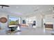 Bright, open kitchen with stainless steel appliances, a large island with bar seating, and access to an outdoor view at 3939 Higel Ave, Sarasota, FL 34242
