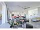 Open concept living area with modern seating and decor, flowing into a bright kitchen and dining space at 3939 Higel Ave, Sarasota, FL 34242