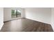 Inviting bedroom with new flooring, a large window, and plenty of natural light at 4001 Beneva Rd # 304, Sarasota, FL 34233
