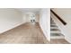 Open living area with tile floors and staircase at 4001 Beneva Rd # 304, Sarasota, FL 34233
