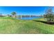 Scenic backyard view showcasing a large pond and lush green space at 4514 Big Woods Way, Parrish, FL 34219