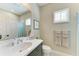 Cozy bathroom featuring a vanity with sink, a large mirror, and a shower-tub combo at 4514 Big Woods Way, Parrish, FL 34219