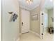 Bright and inviting entryway featuring tile floors, decorative pelican sculpture, and white trim at 4514 Big Woods Way, Parrish, FL 34219
