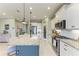 Kitchen with granite countertops, stainless steel appliances, central island with seating and a butler's pantry at 4514 Big Woods Way, Parrish, FL 34219