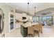 Open kitchen with a granite island, seating, stainless steel appliances and butler's pantry at 4514 Big Woods Way, Parrish, FL 34219