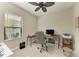 Functional home office space with a ceiling fan, natural light, and a comfortable ergonomic chair at 4514 Big Woods Way, Parrish, FL 34219