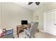 Functional home office space with a ceiling fan, natural light, and a comfortable ergonomic chair at 4514 Big Woods Way, Parrish, FL 34219