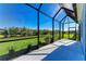 Screened patio featuring a view of the landscaped backyard at 4514 Big Woods Way, Parrish, FL 34219