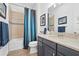 Bathroom with a tub and shower combination, a granite countertop vanity, and neutral tiling at 4534 Trento Pl, Bradenton, FL 34211