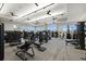 Workout room featuring various workout machines, ceiling fans, and ample natural light at 4534 Trento Pl, Bradenton, FL 34211