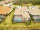 Aerial view of the home showing the landscaping and screened-in pool and lanai at 5305 Brookgrove Dr, Sarasota, FL 34238